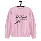 You're Never Fully Dressed Without a Smile Unisex Sweatshirt