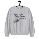 You're Never Fully Dressed Without a Smile Unisex Sweatshirt